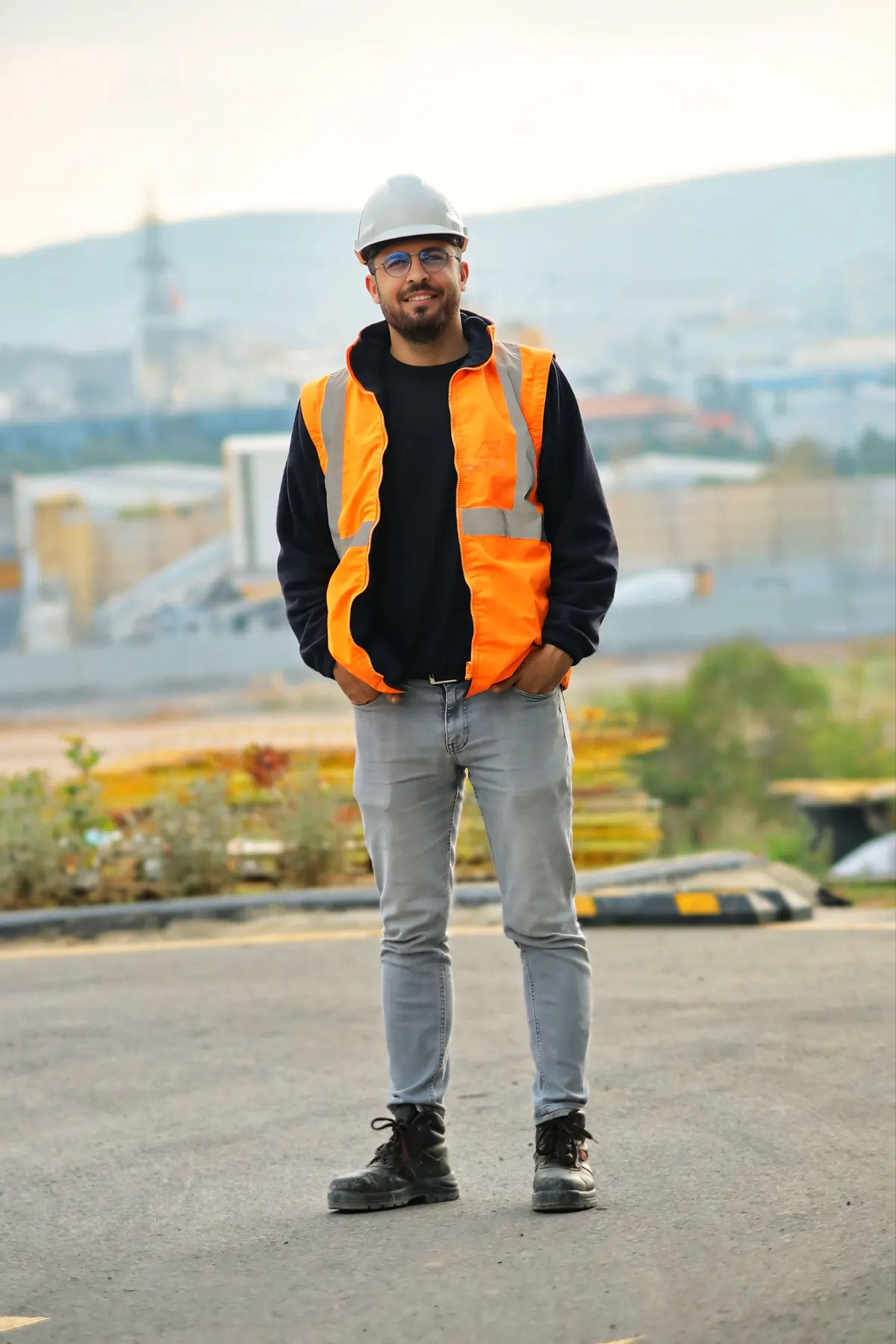 Construction labourer in hi-vis vest and hard hat providing site support