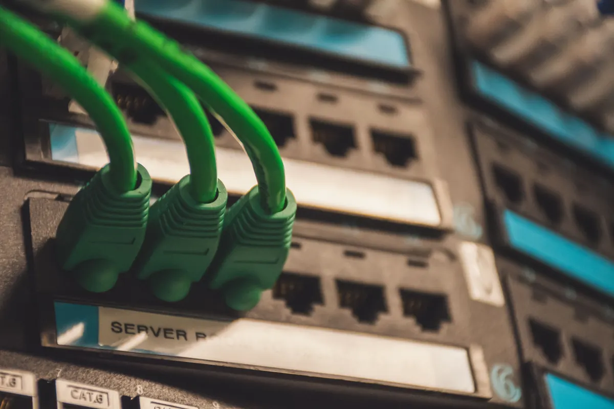 Close-up of structured network cabling connected into a server patch panel